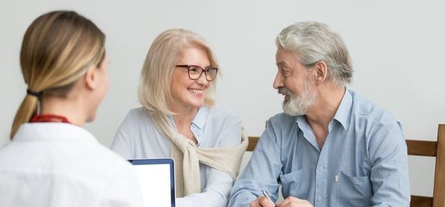 elderly-couple-speaking-to-professional